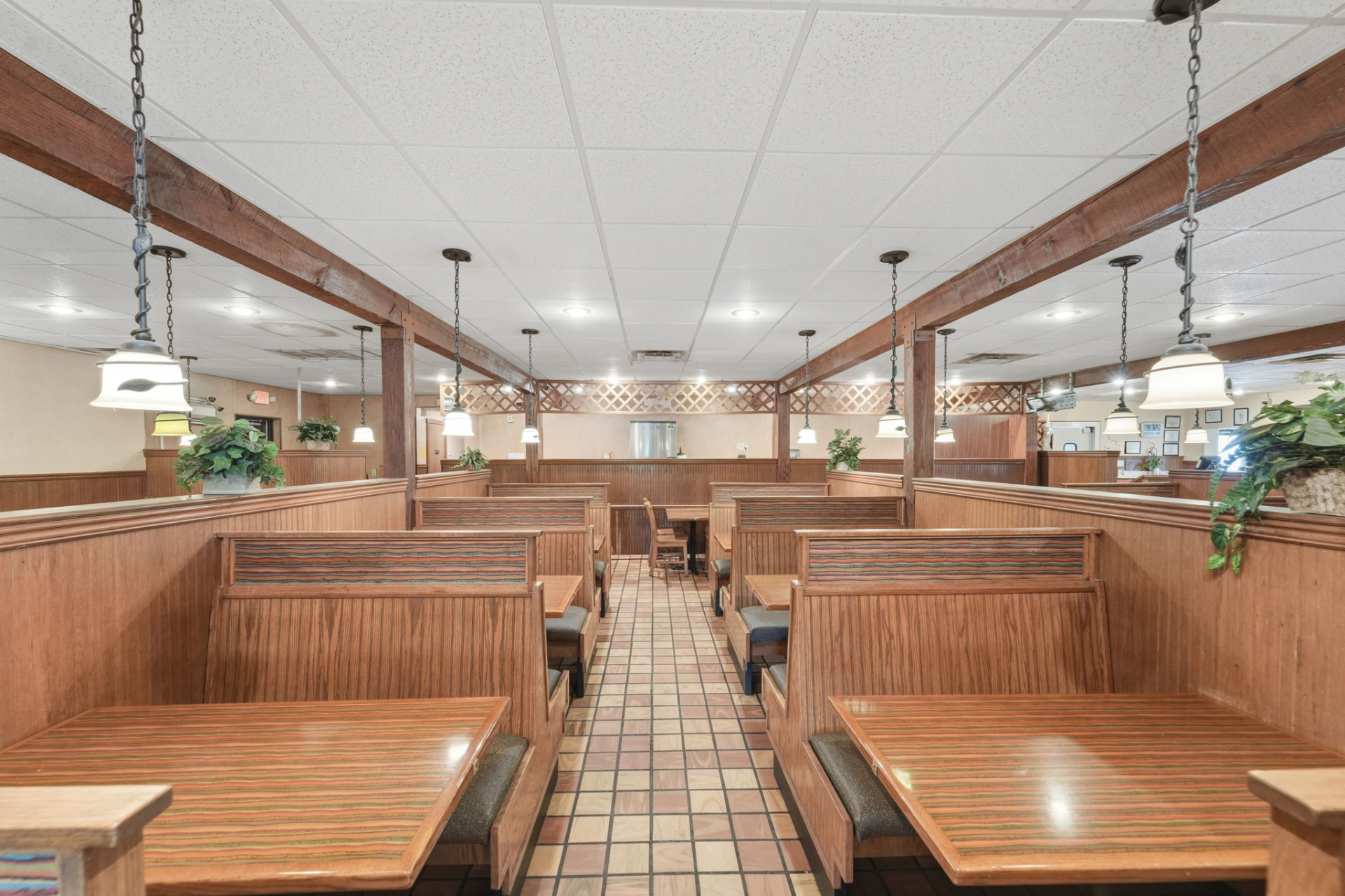 Restaurant dining room interior with wood booths