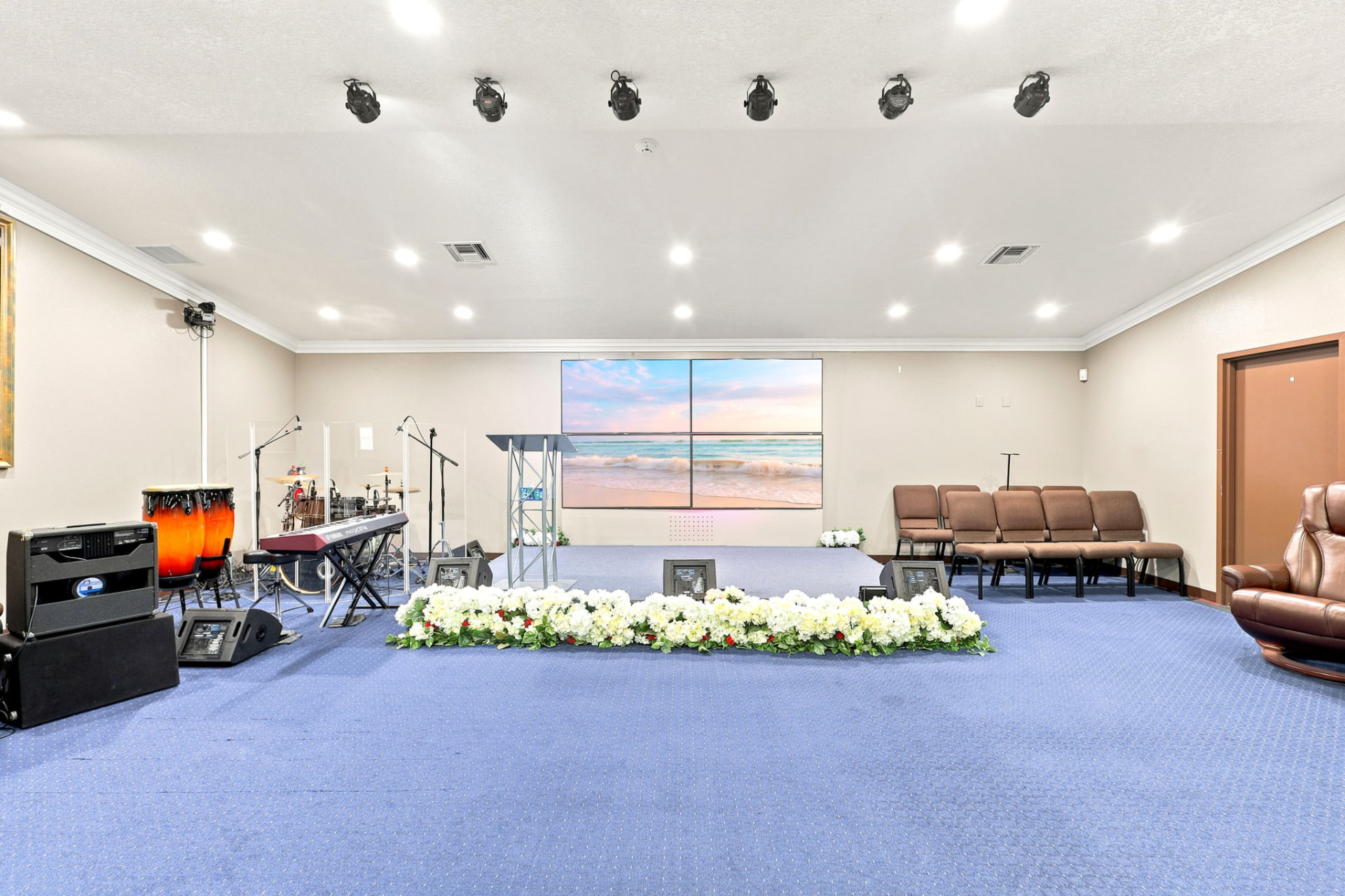 Church stage with video wall, podium and band equipment