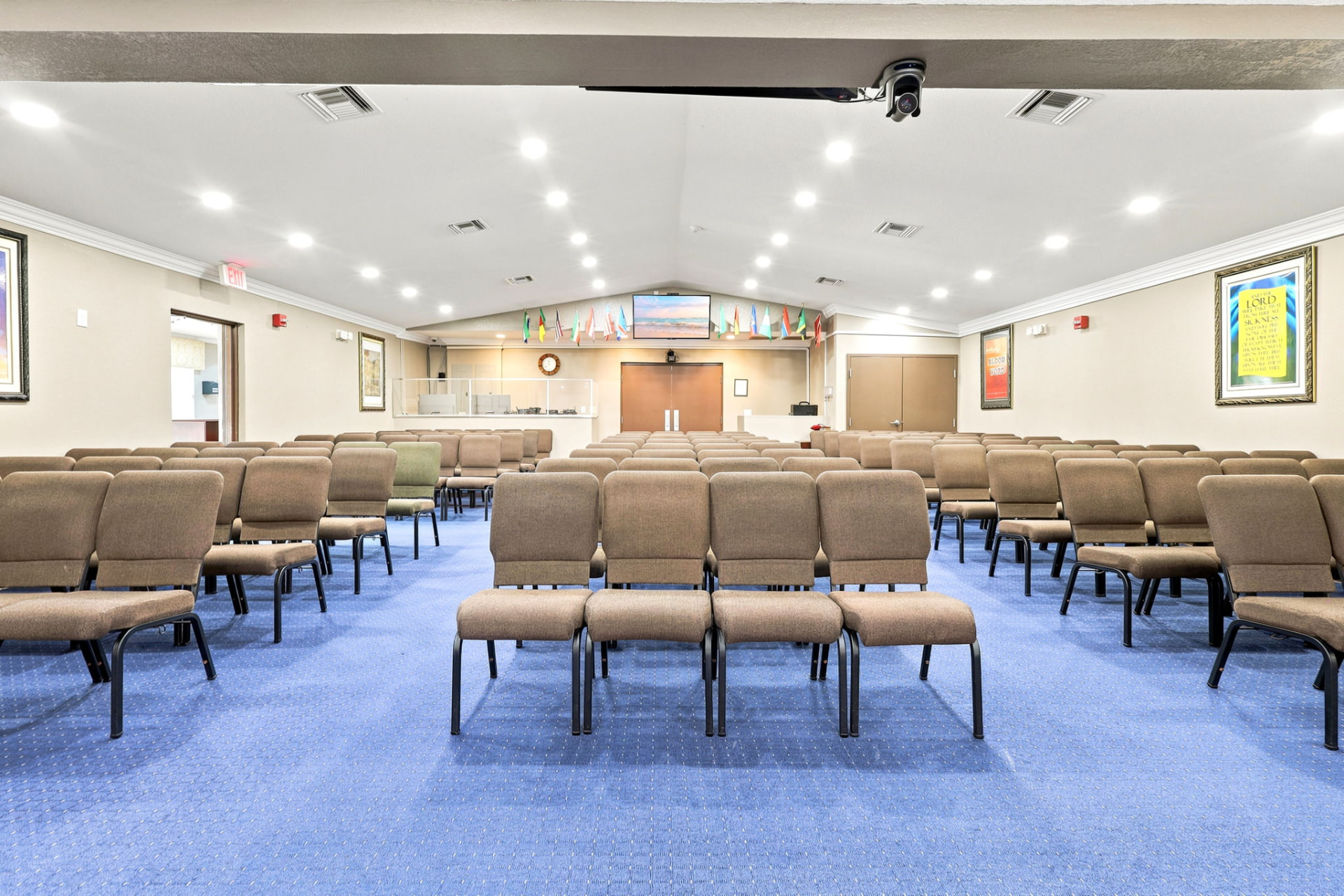 Church sanctuary with rows of seating and vaulted ceiling